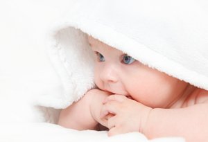 Baby wrapped in clean towel, never worry about dingy laundry again.